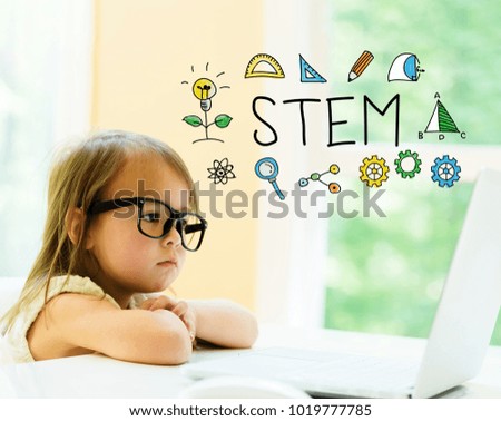 STEM text with little girl using her laptop