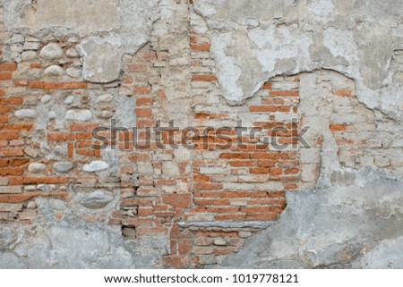 Old red and white brick wall destroyed useful background or texture