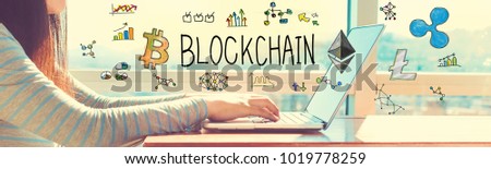 Blockchain with woman working on a laptop in brightly lit room