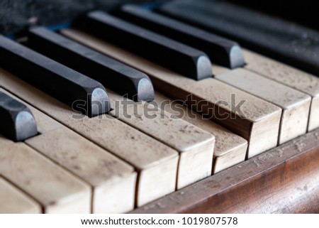 old dirty piano keys need cleaning, close up
