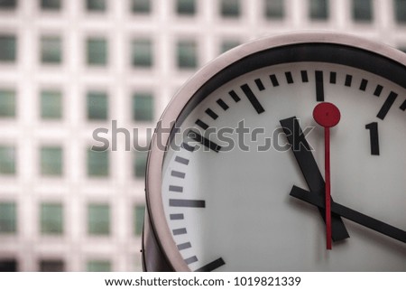 Clock in front of office block