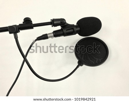 Black microphone on white background for singer, sound recording  equipment