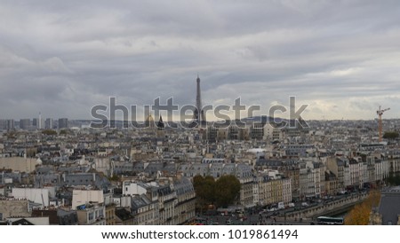 Paris, France. Cityscape. Panoramic view from the top of the Notre Dame cathedral. Cloudy sky.
