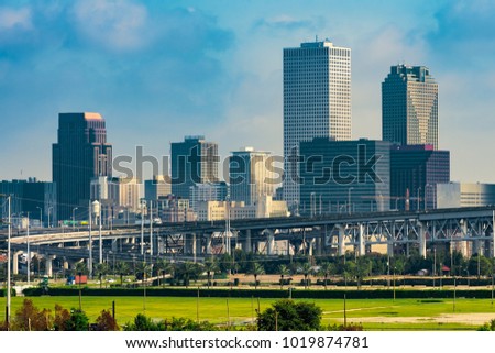 Sunny day in New Orleans, LA. Road overpass and down-town behind as seeing from Mississippi