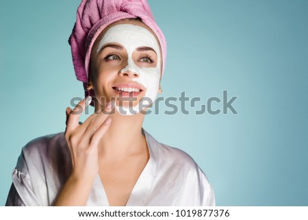 happy woman after shower put mask on face