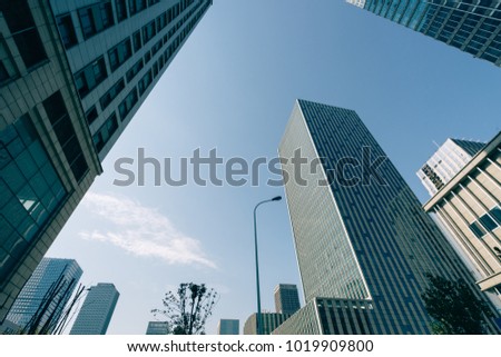 Modern office building against blue sky
