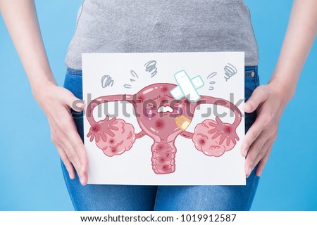 woman take unhealth uterus billboard on the blue background