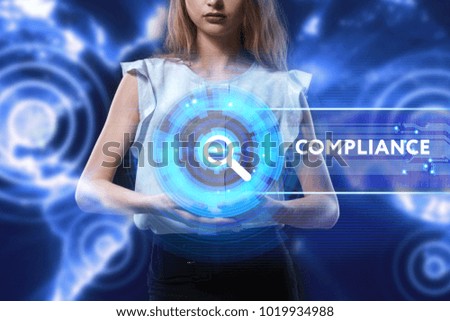 The concept of business, technology, the Internet and the network. A young entrepreneur working on a virtual screen of the future and sees the inscription: Compliance