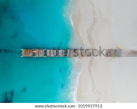 Drone photo of pier in Grace Bay, Providenciales, Turks and Caic Royalty-Free Stock Photo #1019937913