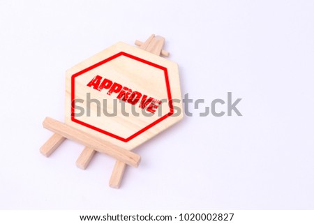 APPROVED writing on small wood board isolated on white background