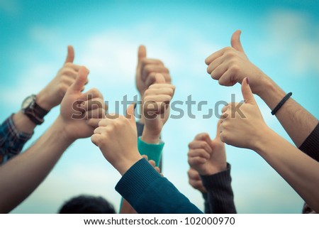 College Students with Thumbs Up Royalty-Free Stock Photo #102000970