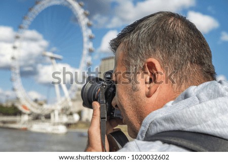 Male photographer in London.