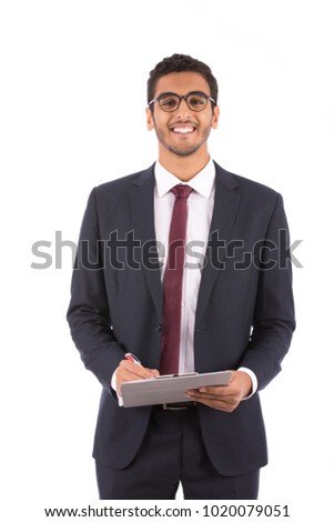 a portrait of a smart young man wearing glasses and a suit, holding a clipboard, isolated on a white background