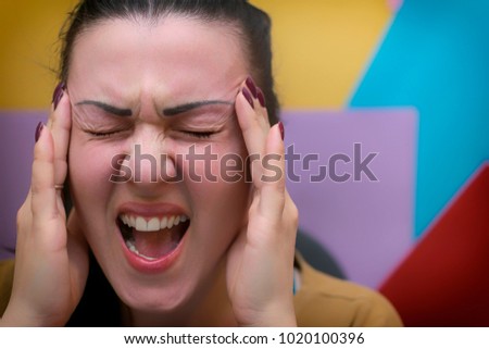 Girl holding her head. Headache. Work Stress