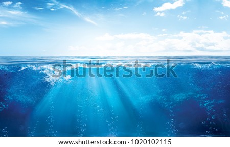 BLUE UNDER WATER waves and bubbles Royalty-Free Stock Photo #1020102115