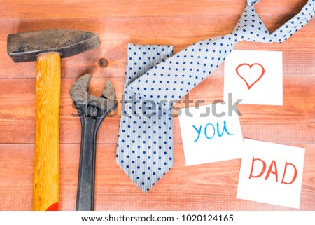 Different working tools on the wooden table, Father`s day celebration.