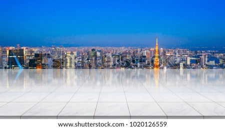 Business concept - Empty marble floor top with panoramic modern cityscape building bird eye aerial view under sunrise and morning bright sky of Tokyo, Japan, for display or montage product
