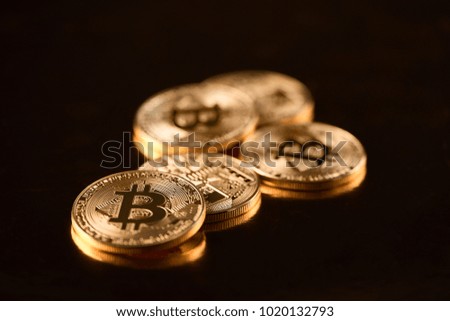 Stack of golden bitcoins as world main cryptocurrency isolated on black background. Digital virtual web electronic money blockchain pay finance banking mining futuristic business innovation