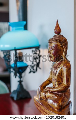 Wooden buddha statue like living room interior decor element