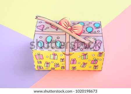 Gift box on a background of pastel colors paper.