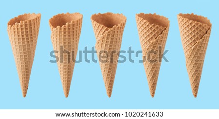 Various ice cream cones isolated on blue background. Royalty-Free Stock Photo #1020241633