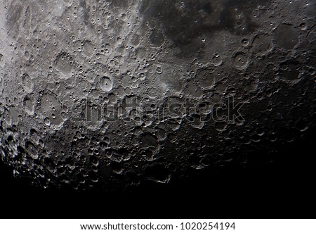 real picture of the moon surface taken by telescope, illustrates how cratered is the south side of it