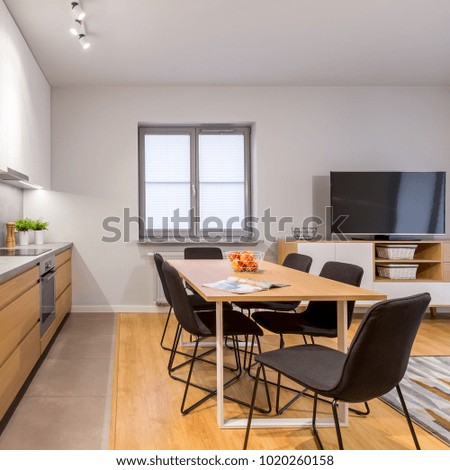 Square photo of modern home interior with wooden furnishing