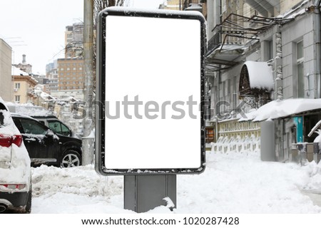 Blank advertising board on city street