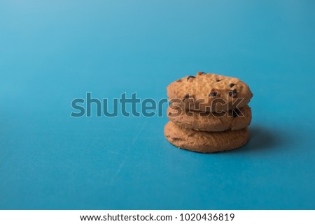 Chocolate chip cookies on blue background