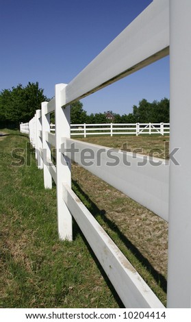White fence of a ranch on the countryside in the Netherlands.