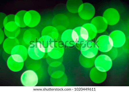 Texture from the blurred green circles in bokeh style for design. Defocused lights of the city.