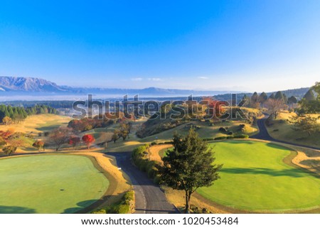 Beautiful pictures of mountains and mist,Pine trees and trees change color Including a golf course in the morning at ASO,Kumamoto prefecture,Japan
