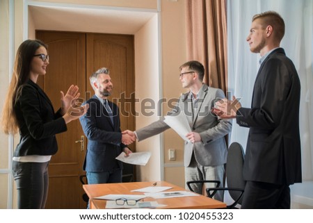 handshake at the signing of the contract in the office of businessmen