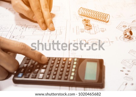 hand engineer draft the drawing with engineering tools and calculator on the desk office.