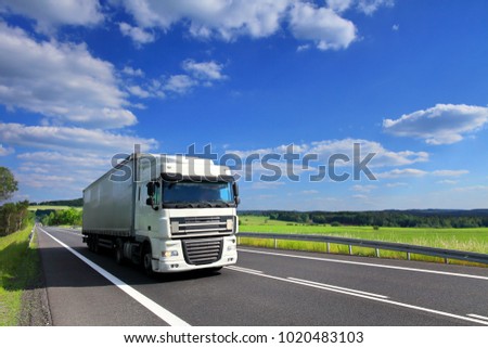 Truck transportation on the road Royalty-Free Stock Photo #1020483103