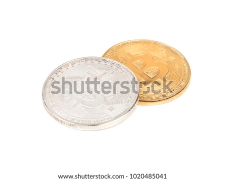 Gold and silver bitcoin coins on a white background