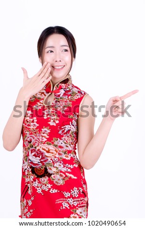 Portrait of beautiful asian woman in chinese dress traditional cheongsam. chinese new year concept. Cheerful girl in red cheongsam on white background.