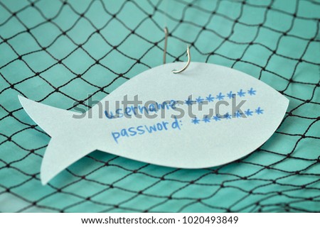 Username and password written on a paper note in the shape of a fish attached to a hook - Phishing and internet security concept
