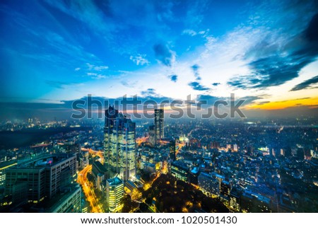 Asia Business concept for real estate and corporate construction - panoramic modern city skyline aerial night view of Shinjuku area under twilight sky in Tokyo, Japan