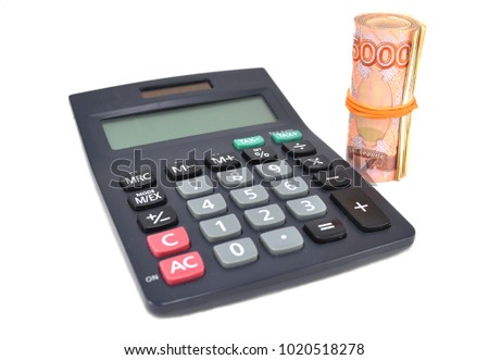 Money and calculator on white background closeup