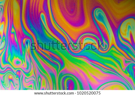 Psychedelic abstract formed by light interference on the surface of a soap bubble Royalty-Free Stock Photo #1020520075