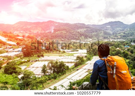 Man with backpack hiking in mountains Travel Lifestyle In the countryside northern, Thailand