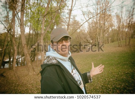 A woman enjoys nature near the lake.