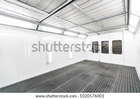 Spray paint cabinet in a car repair station. Auto service concept. High-quality painting of vehicles in a room with a filter and good light Royalty-Free Stock Photo #1020576001