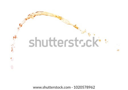 Splash of multi-colored red to yellow liquid in motion isolated over the white background