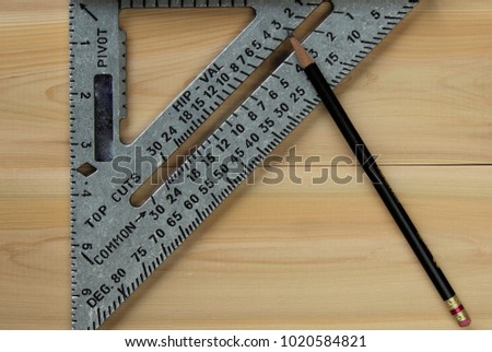 Carpenter's / Triangle Square with a Black Pencil on Lumber / Boards