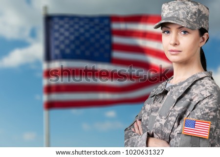 Woman Of A Solider Saluting Against