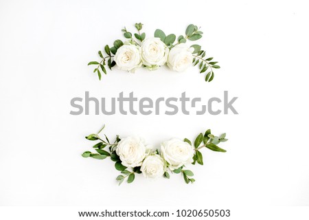 Floral frame wreath of white rose flower buds and eucalyptus on white background. Flat lay, top view mockup. Royalty-Free Stock Photo #1020650503