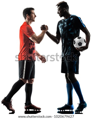 two soccer players men in studio silhouette isolated on white background Royalty-Free Stock Photo #1020679627