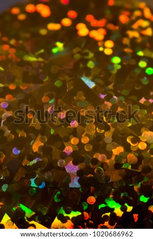 Colorful carnival background, with holographic pattern and a special glittery effect. Parties and celebrations atmosphere